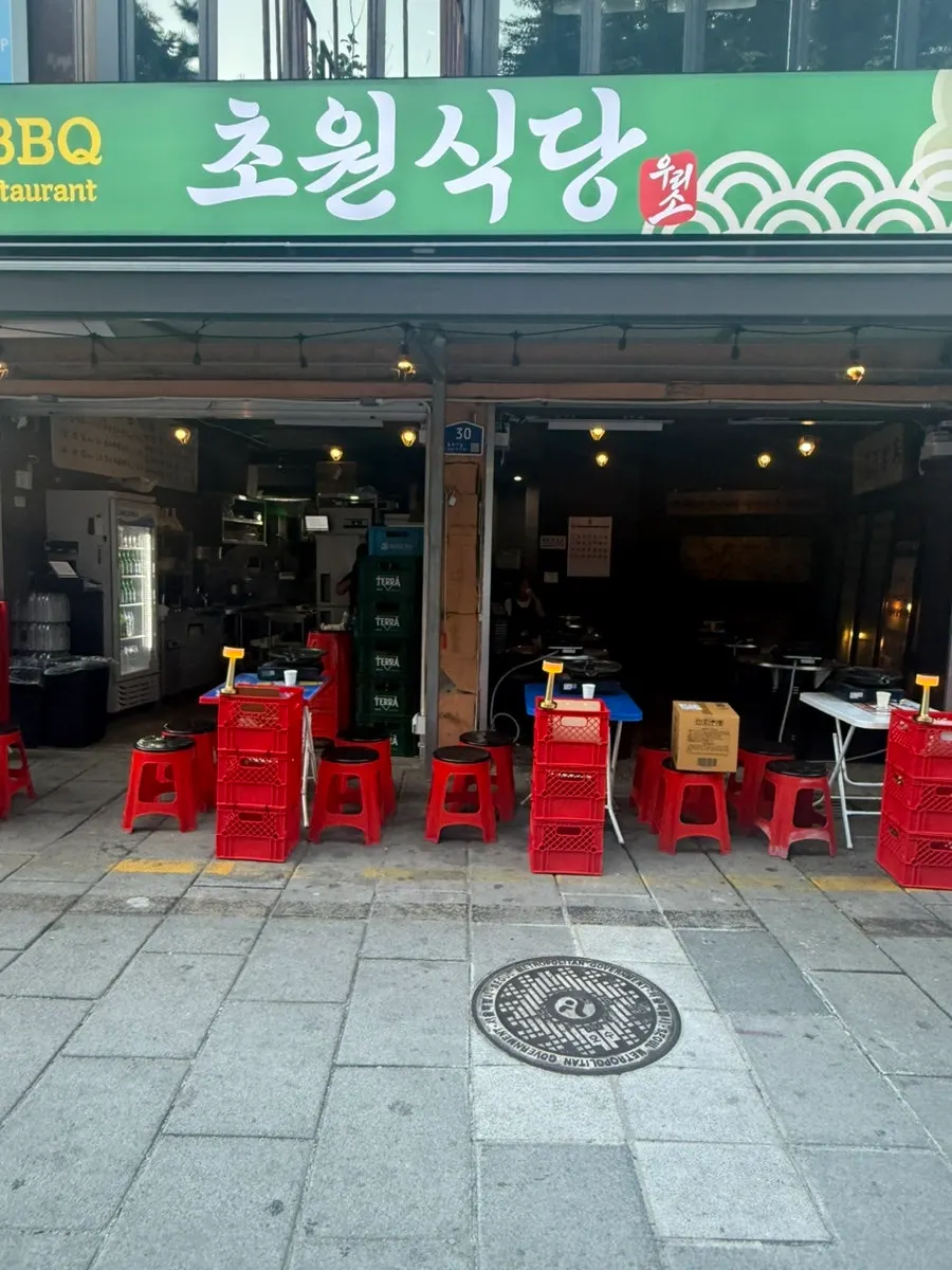 Outdoor BBQ atmosphere in a Jongno 3-ga evening alley
