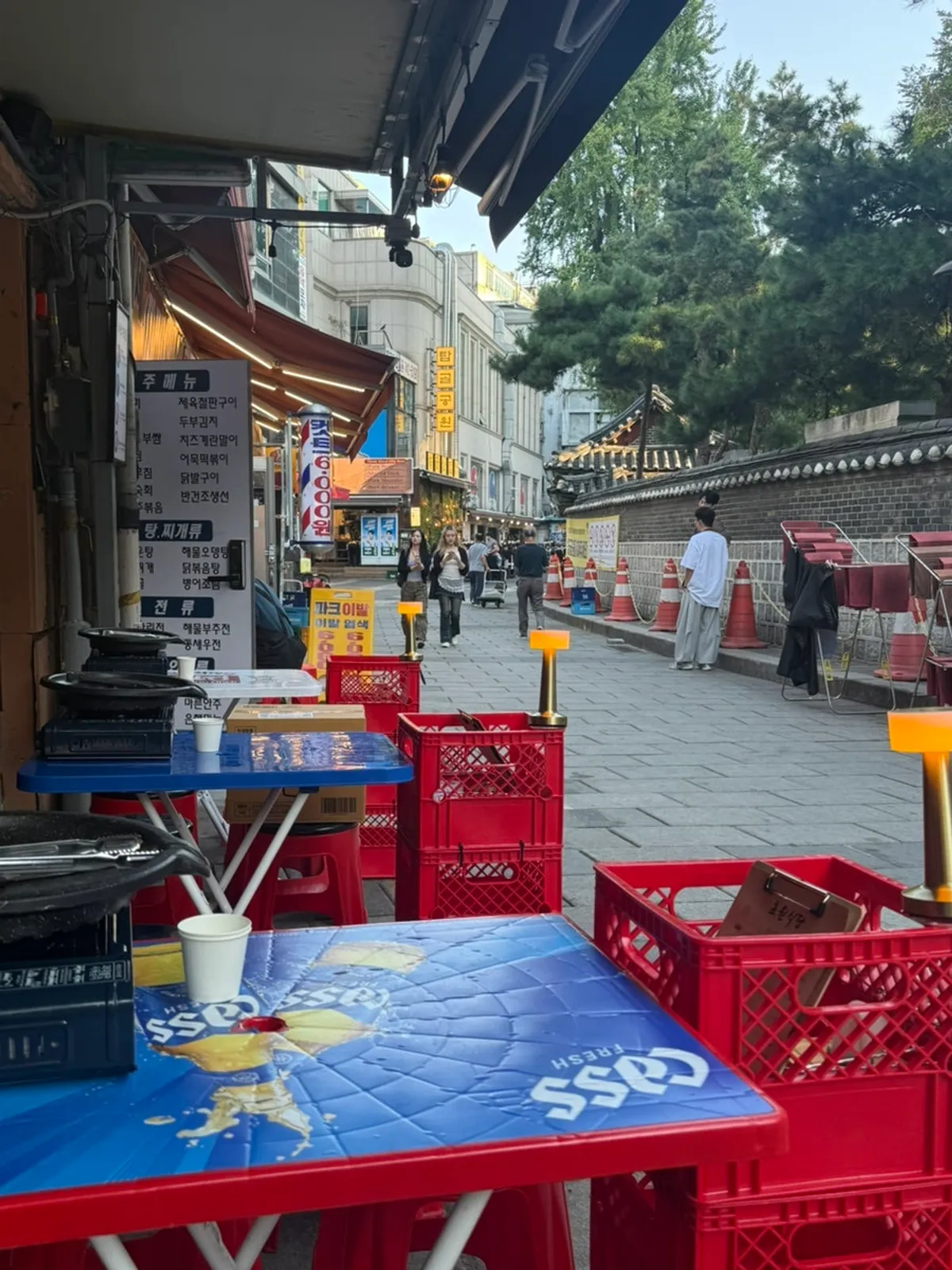 Street view of Chowon Restaurant Jongno 3-ga Branch's red outdoor tables
