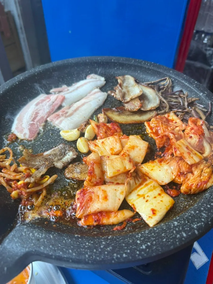 A pork belly spread enjoyed at the outdoor table