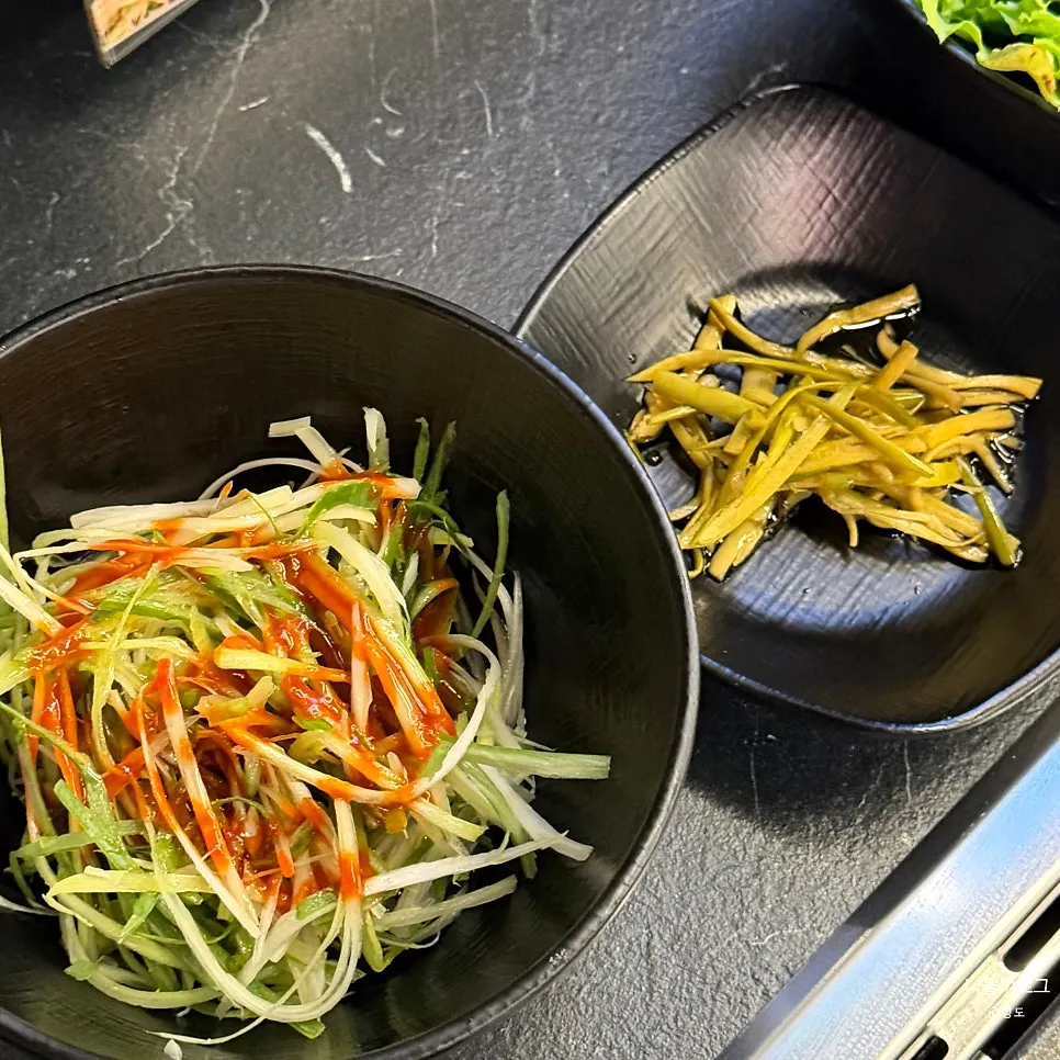 Scallion salad, pickled garlic scapes, and other veggie side dishes