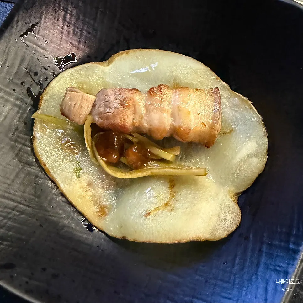 Potato slice wrap topped with meat and shiitake wasabi