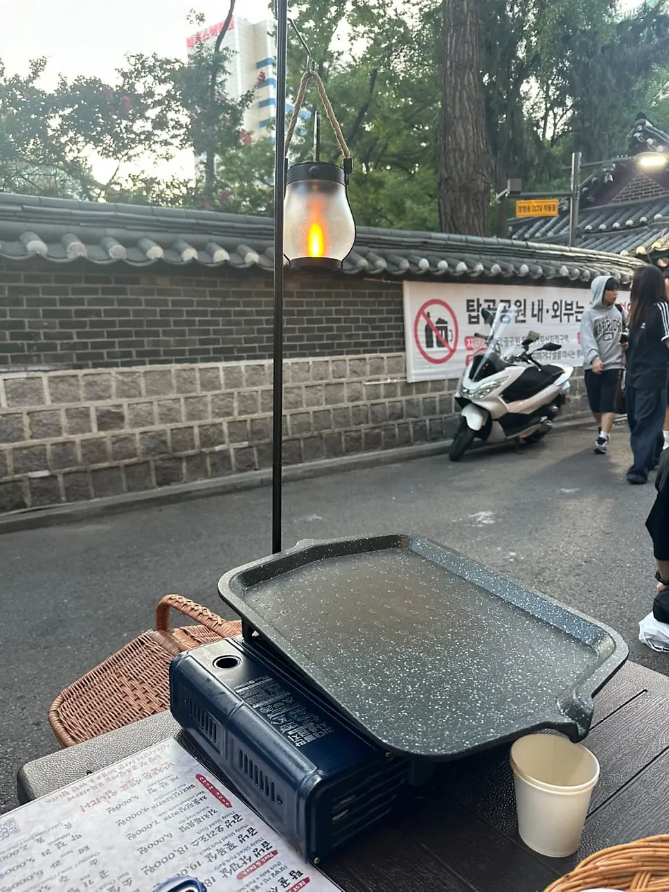 Outdoor tent table with a hanging light overhead