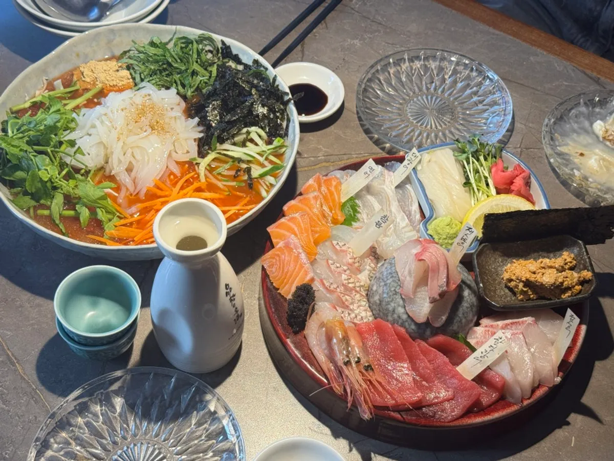 Table spread for a couple's dinner at Suksseong Susan Jongno Main Branch near Jongak Station