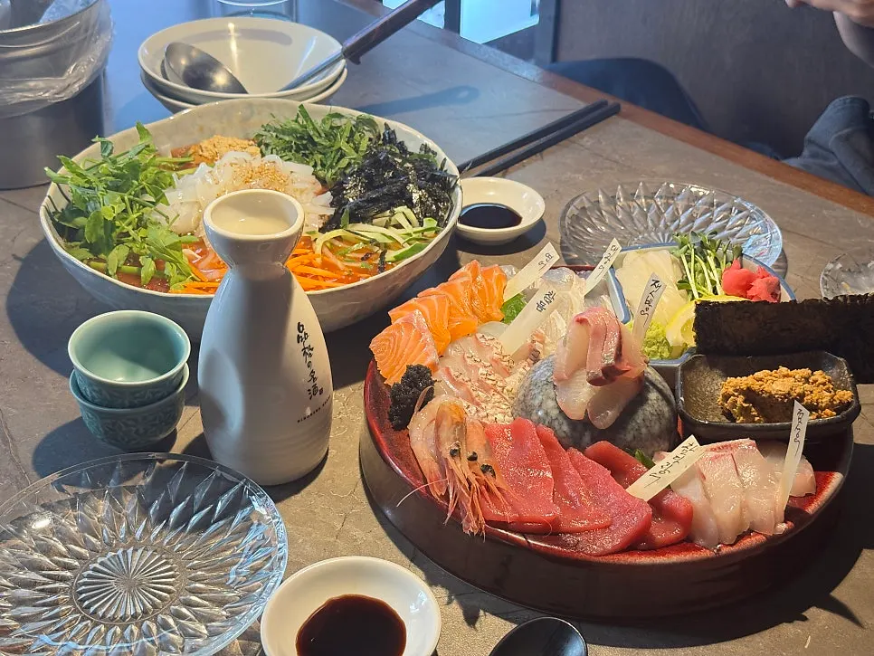 A table set with aged sashimi, mulhoe, and croquette together