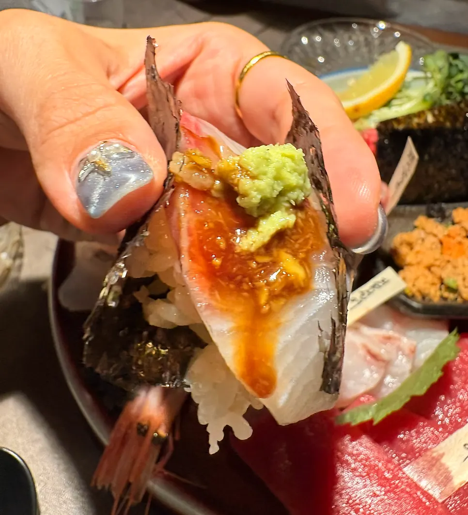 A piece of sashimi placed on vinegared rice