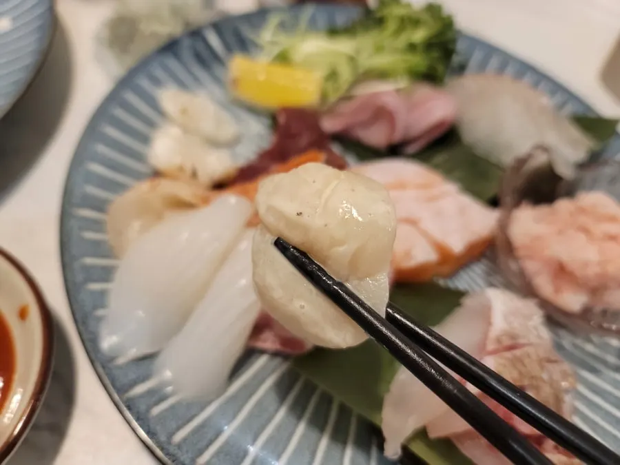Sashimi selection with spear squid, scallop, flounder, and crab meat
