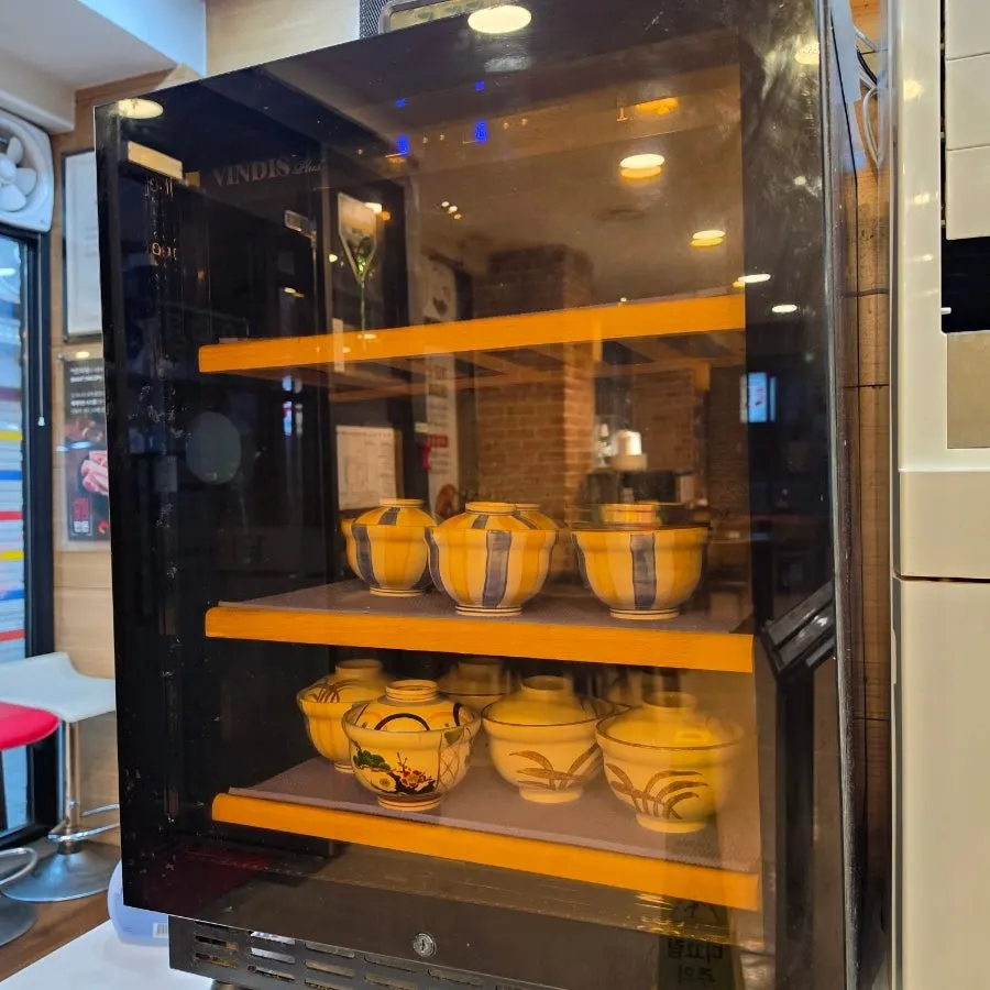 Fried rice bowls set out at the self-serve bar