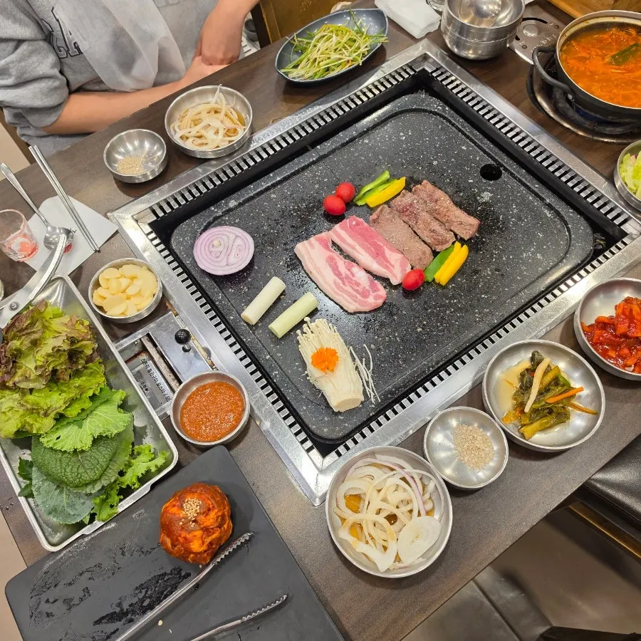 Table setting with scallion shreds and kimchi side dishes