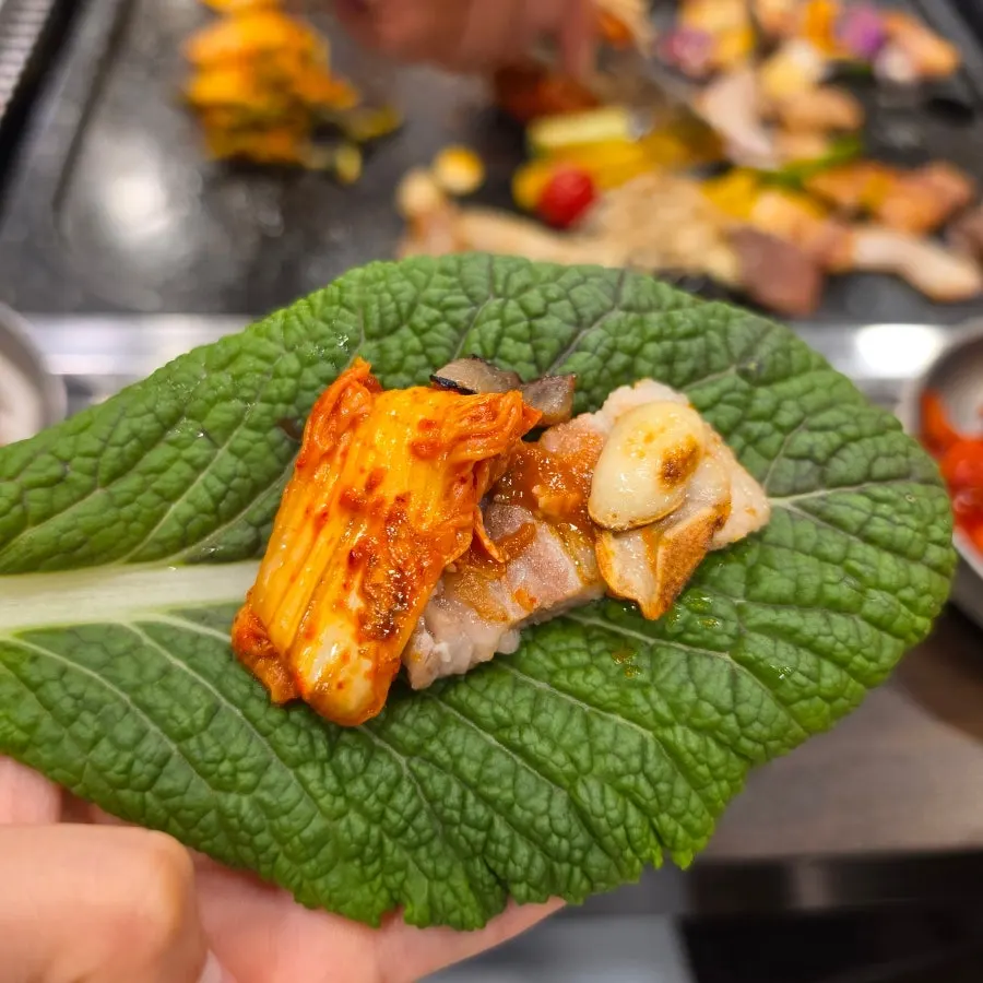 Well-cooked meat and vegetables on the grill
