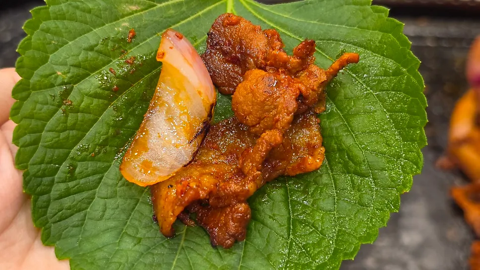 Stir-fried pork placed on the stone plate