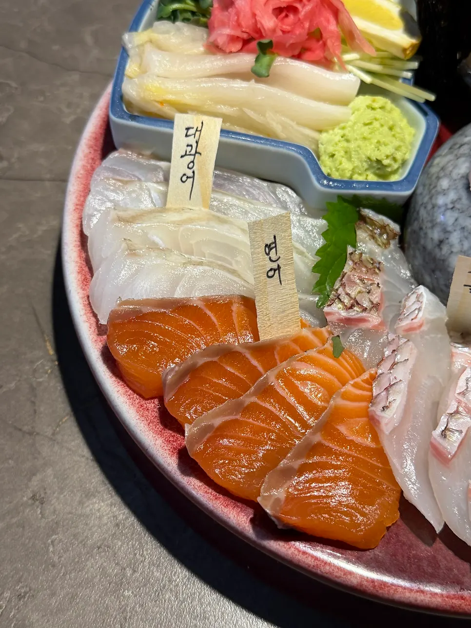 Aged sashimi set for two served with name tags