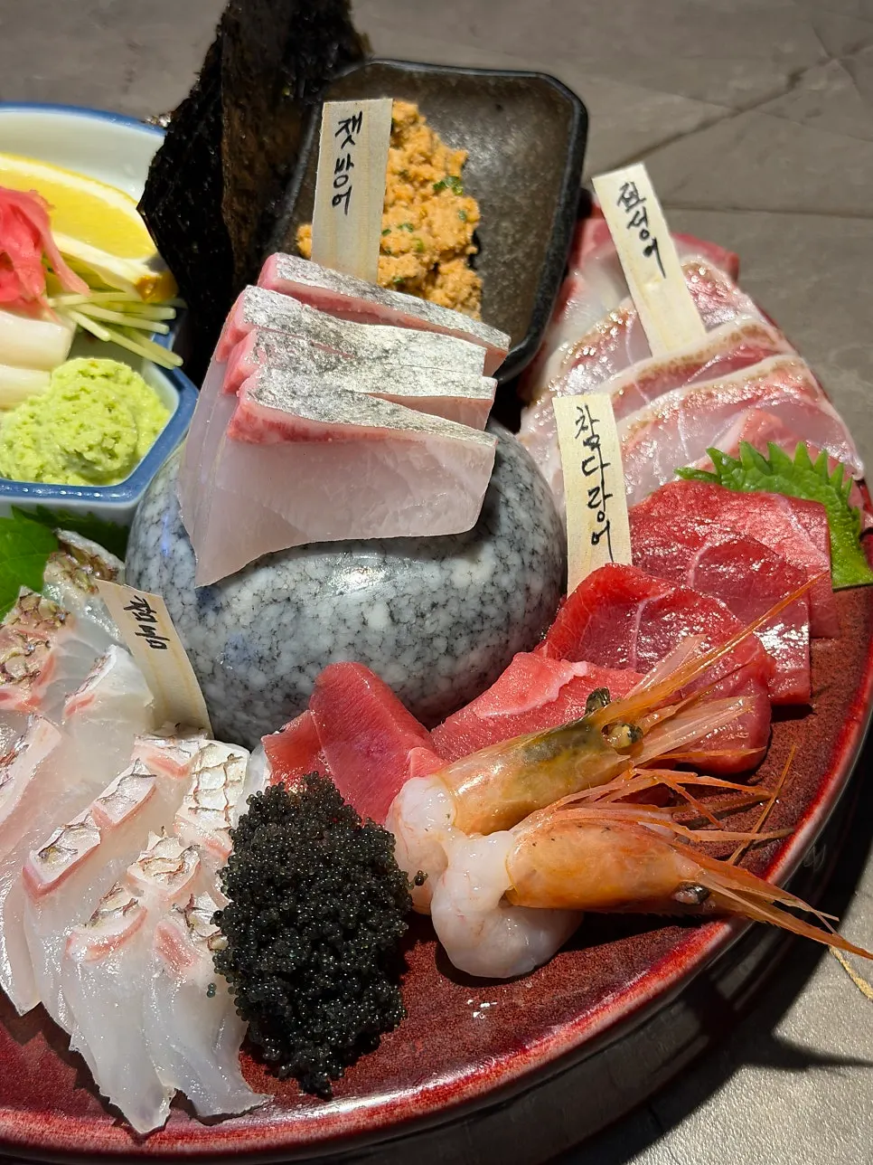 Sashimi platter with fish name tags