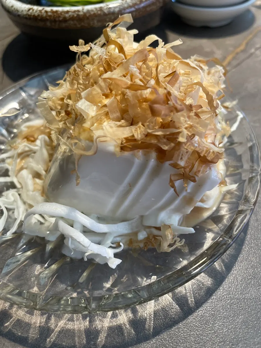 Sashimi dipped in yolk sauce