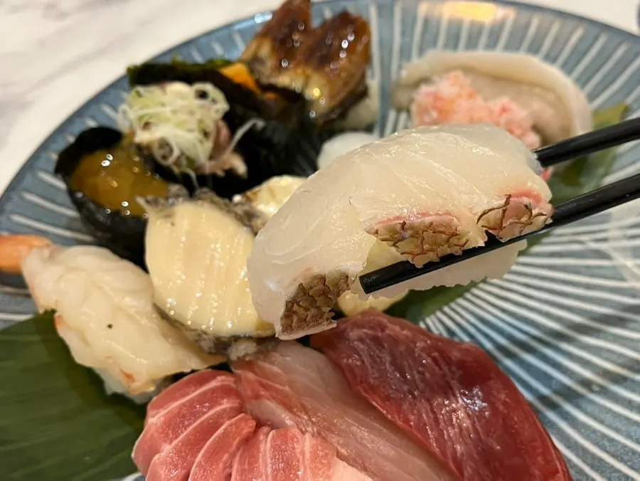 Plate piled full with the premium sushi set, 16 pieces