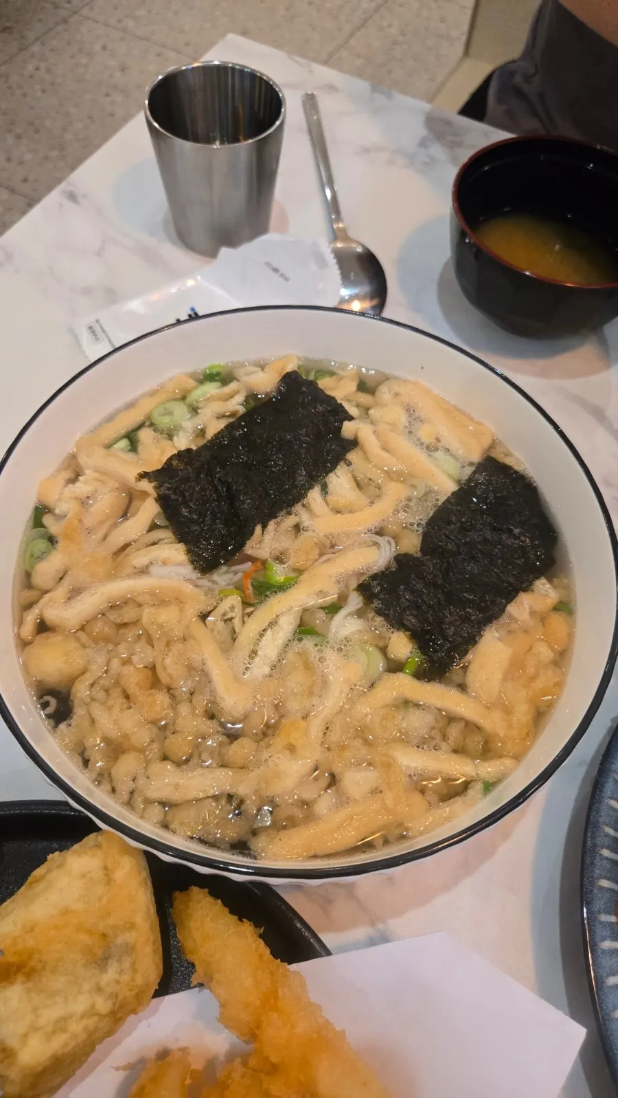 Fried tofu udon served in a large bowl
