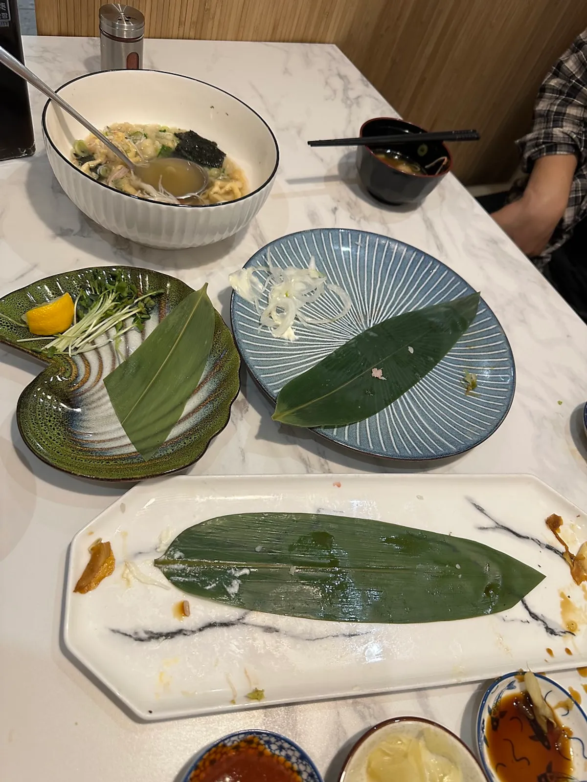 A table set with sushi and sashimi