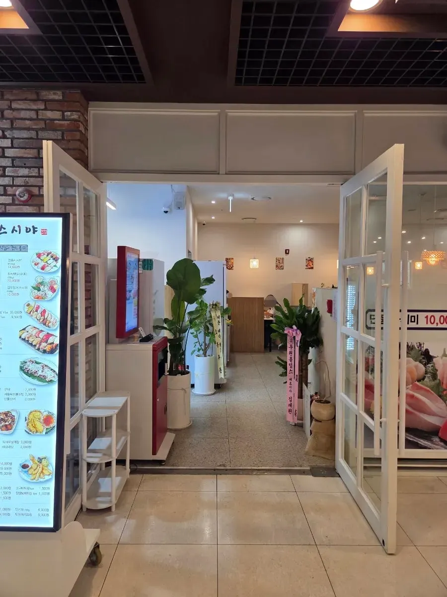 Restaurant entrance with menu board set up outside