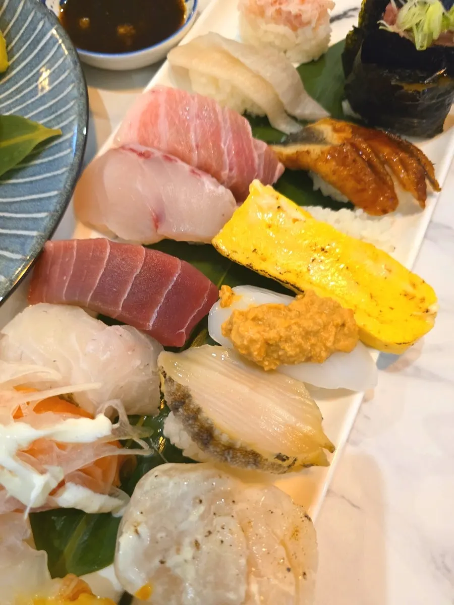The full spread of ordered sushi sets and mixed tempura
