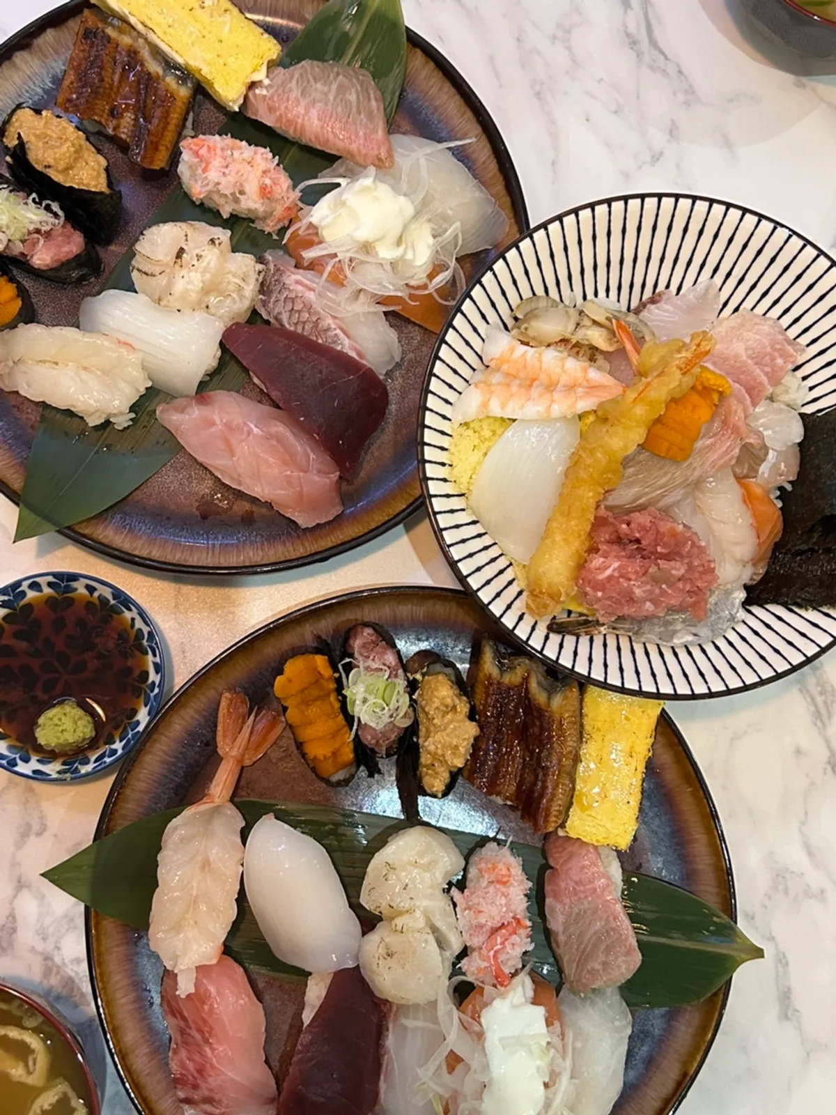Table spread of ordered sushi and kaisendon