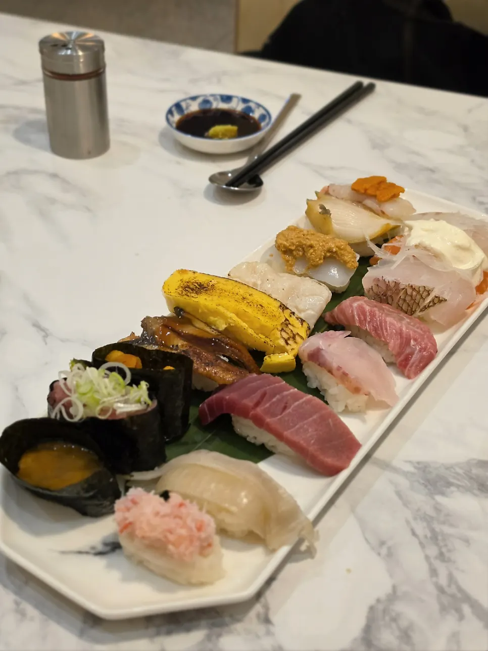 A bite of kaisendon with rice and sashimi combined