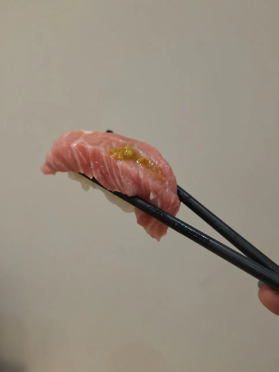 Tuna sushi showing visible marbling