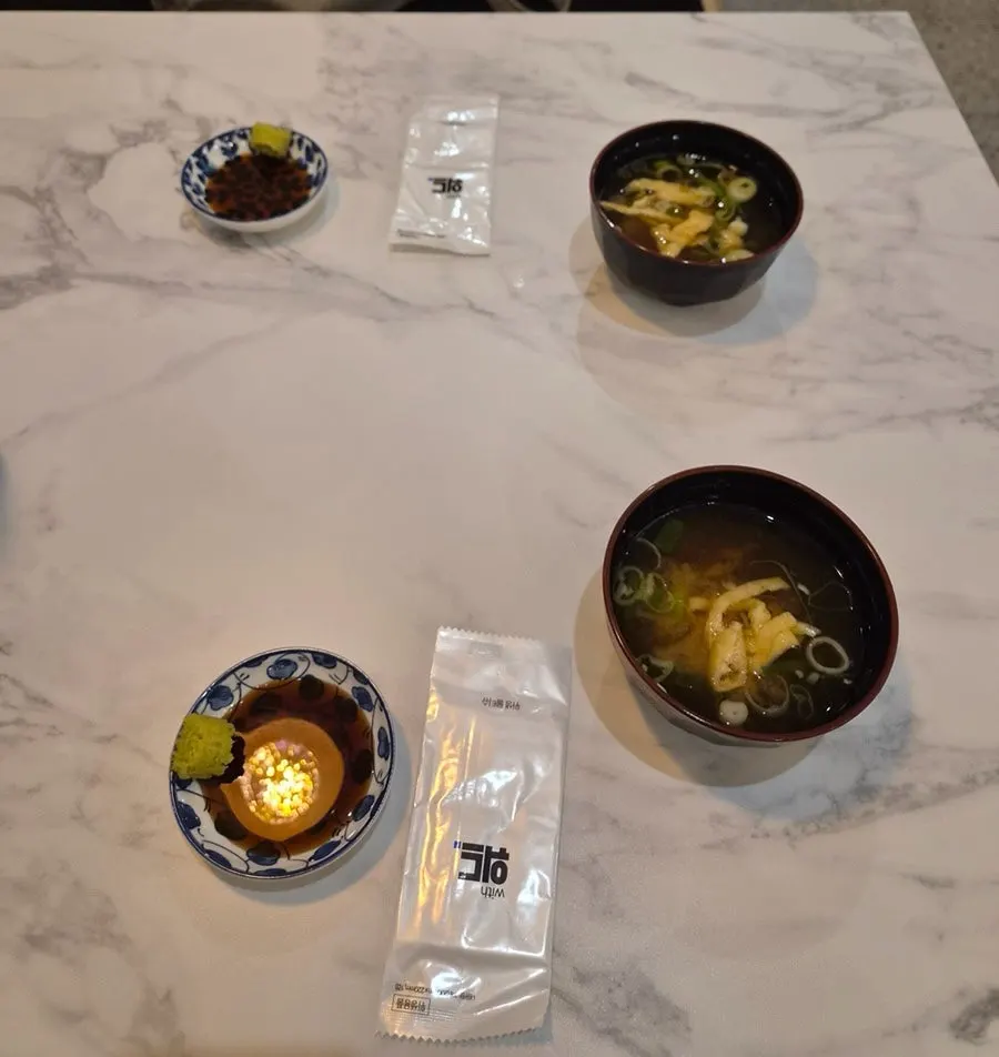 Warm miso soup served as a default side