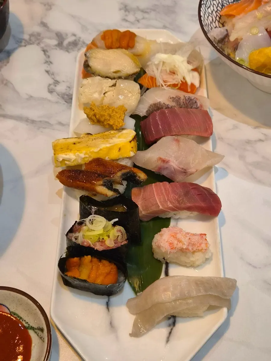 A side plate of red shrimp sashimi
