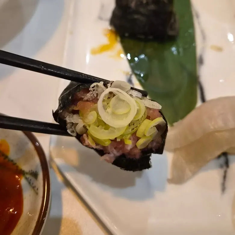 Close-up of sushi topped with thick fish