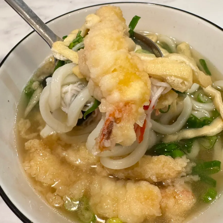Shrimp tempura udon topped with three shrimp tempura