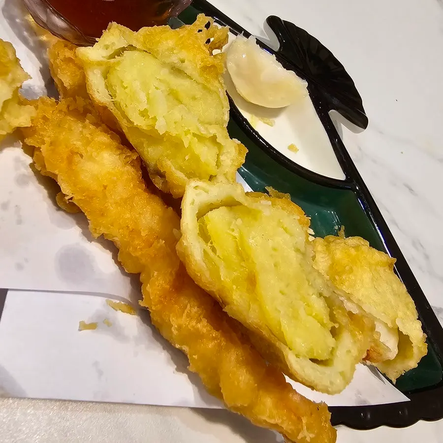 Sweet potato tempura cut in half showing the inside