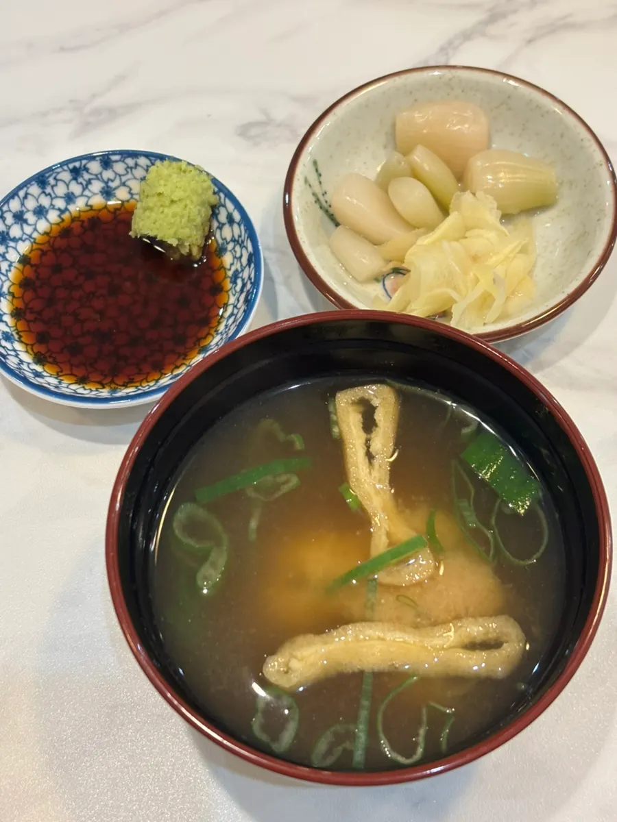 Basic table setting with warm broth and wasabi