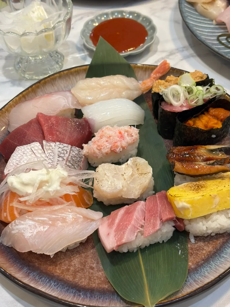 A plate packed with 15 pieces of special sushi