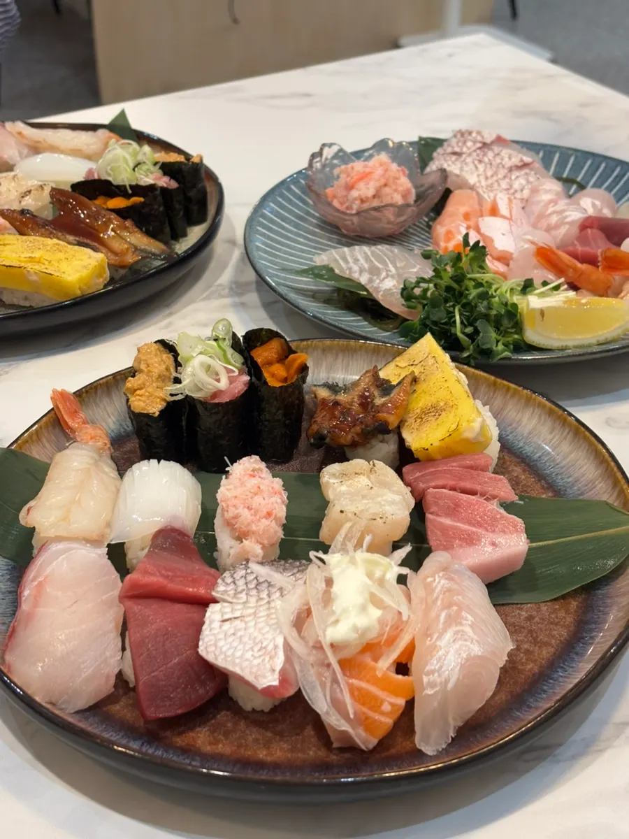 A full spread with sashimi and sushi together