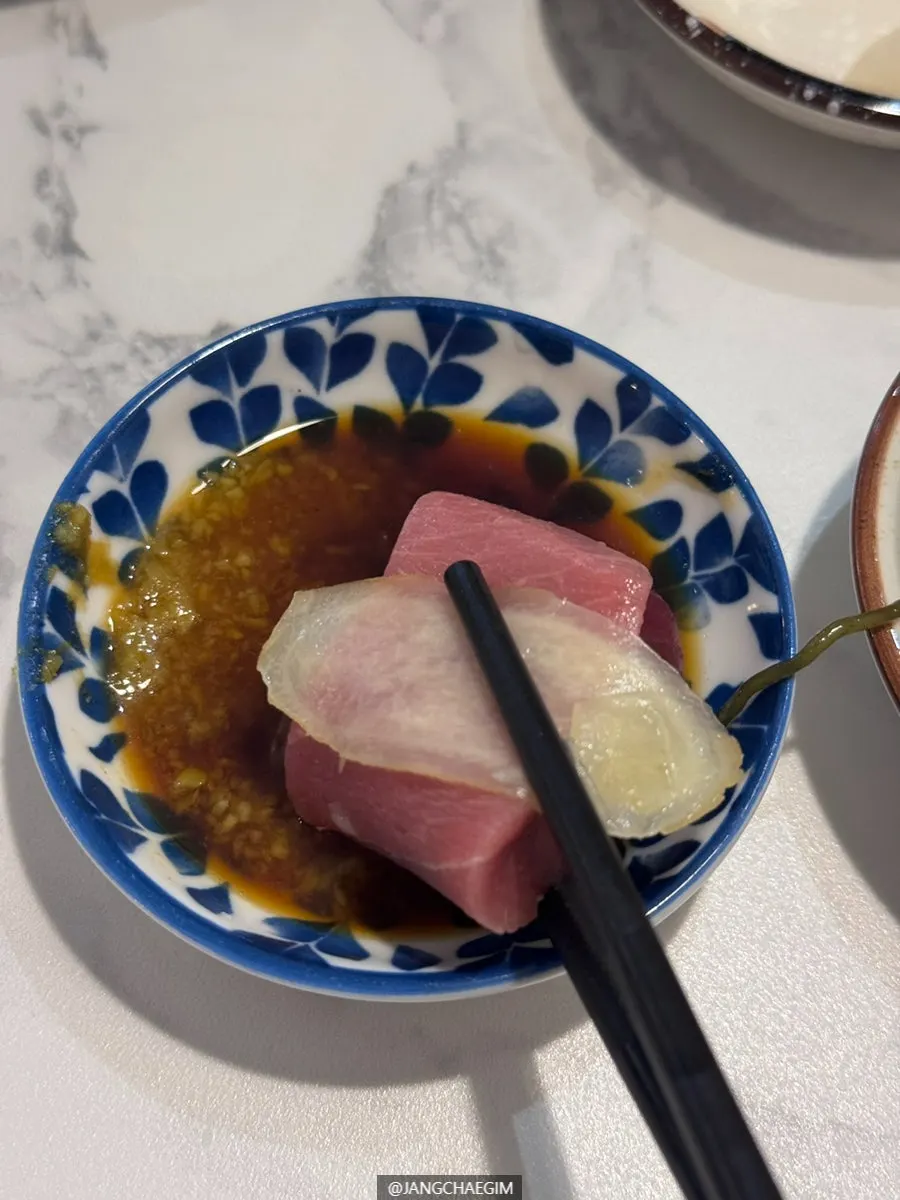 Sashimi with pickled radish and pickled ginger sides