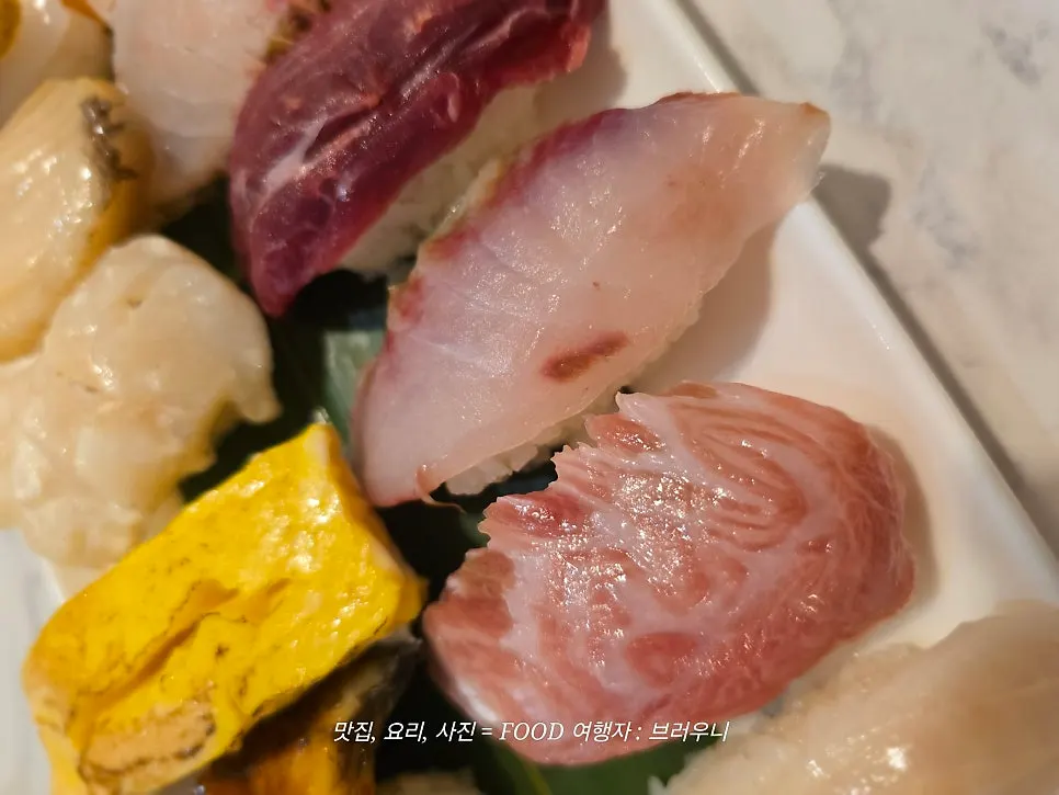 Wide shot of the premium sushi plate laid out horizontally