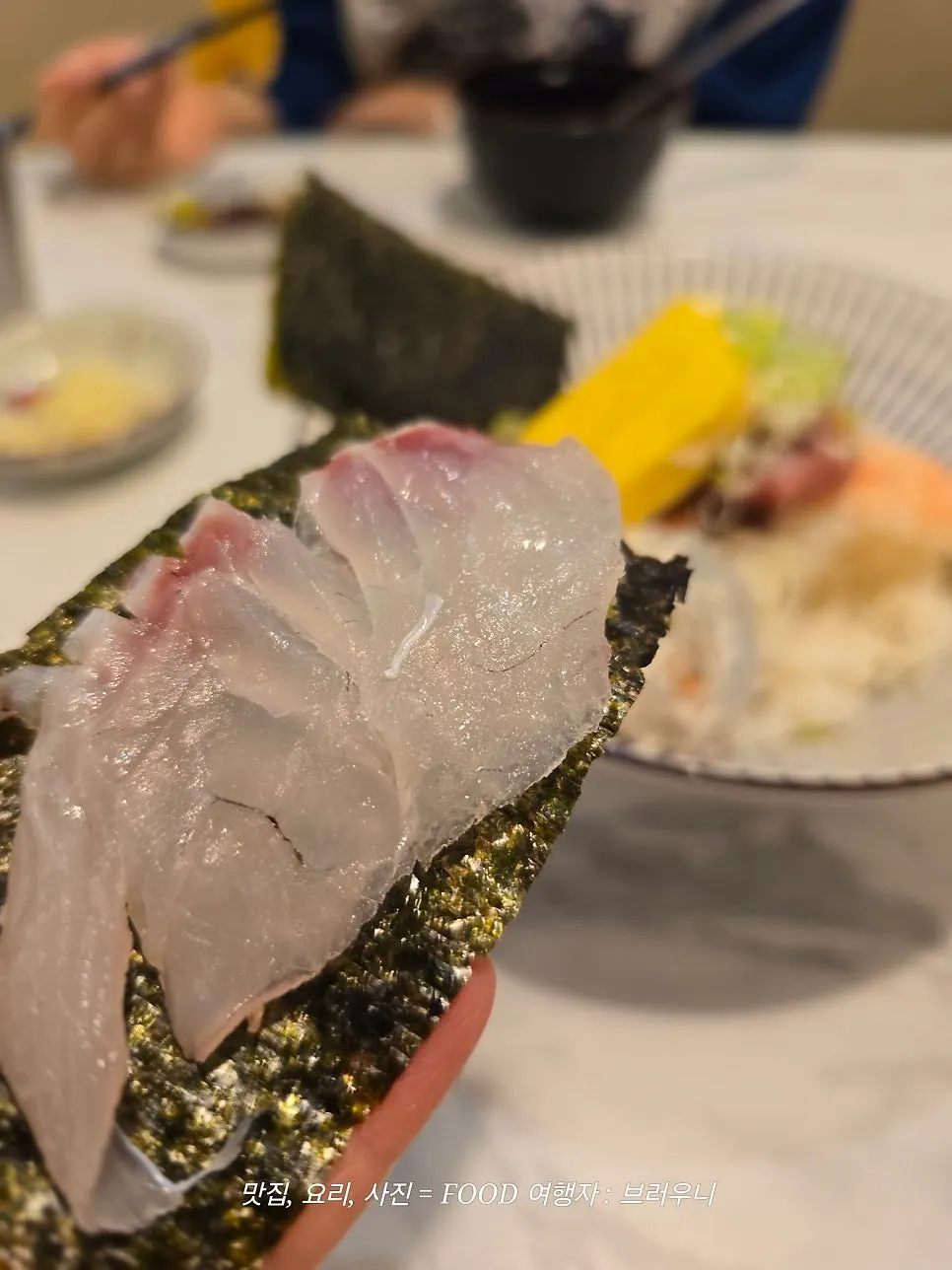 Rice and fish placed on a sheet of seaweed