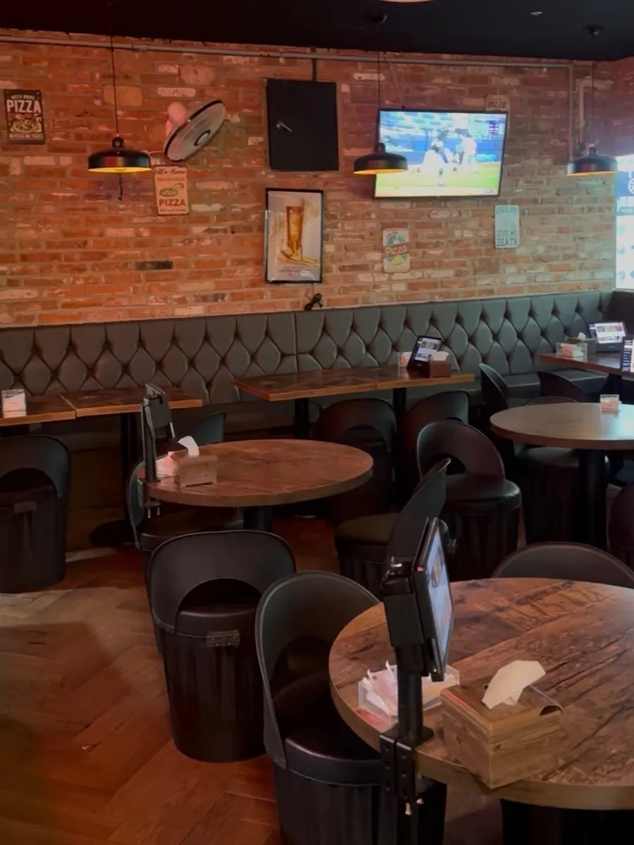 Vertical shot of the interior décor at Didi's Pizza Pub