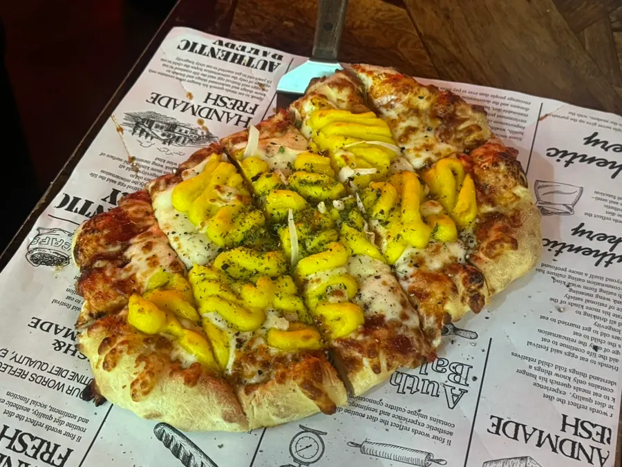 A whole handmade-dough Didi's Sweet Potato Pizza