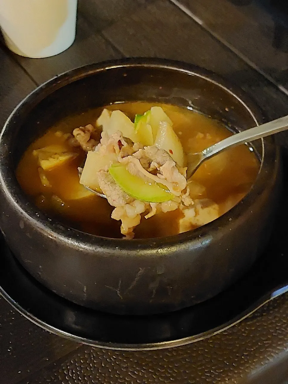Beef brisket doenjang stew bubbling in an earthenware pot