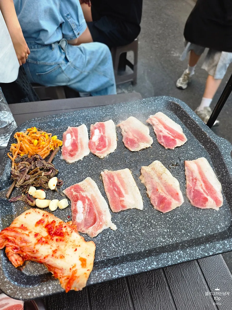 Darkened outdoor table scene at Jongno 3-ga