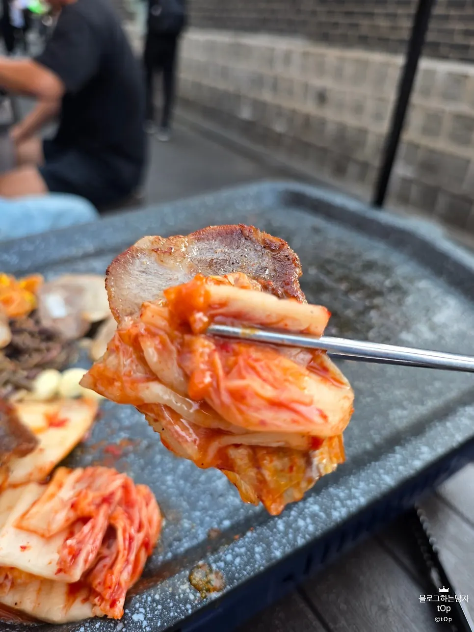 Pork belly and kimchi grilling on the pan