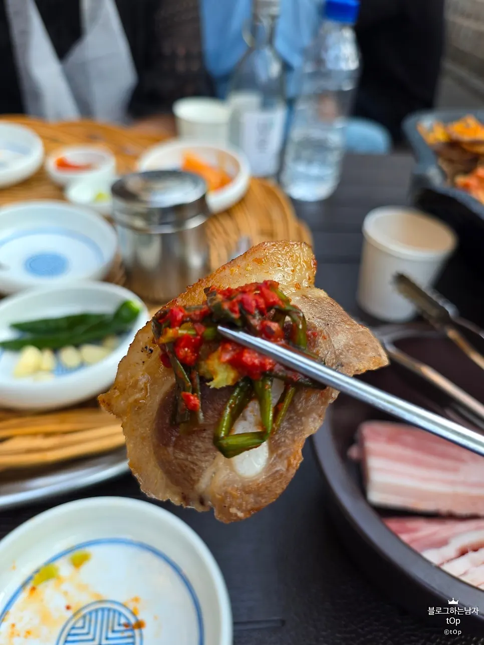 Bracken fern and bean sprouts grilled in pork fat