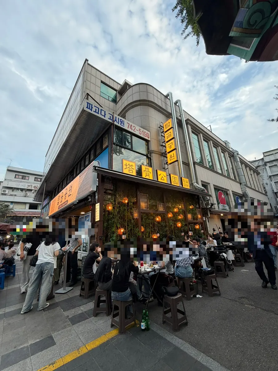In front of the Jongno 3-ga BBQ restaurant with a long weekend evening wait