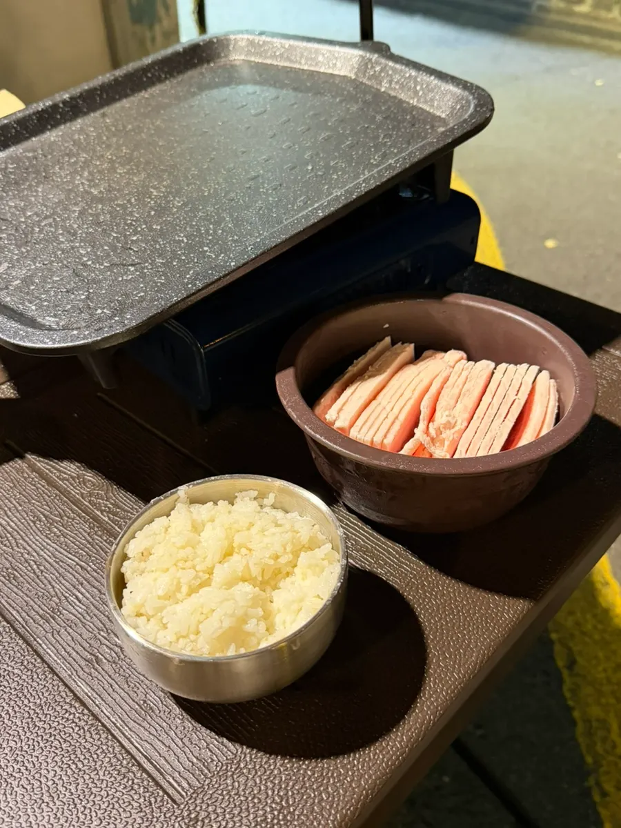 Table setting with thinly sliced frozen pork belly