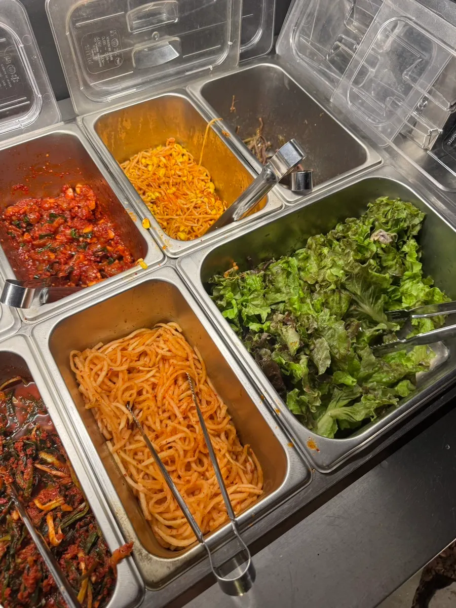 Self-serve bar with kimchi and radish salad