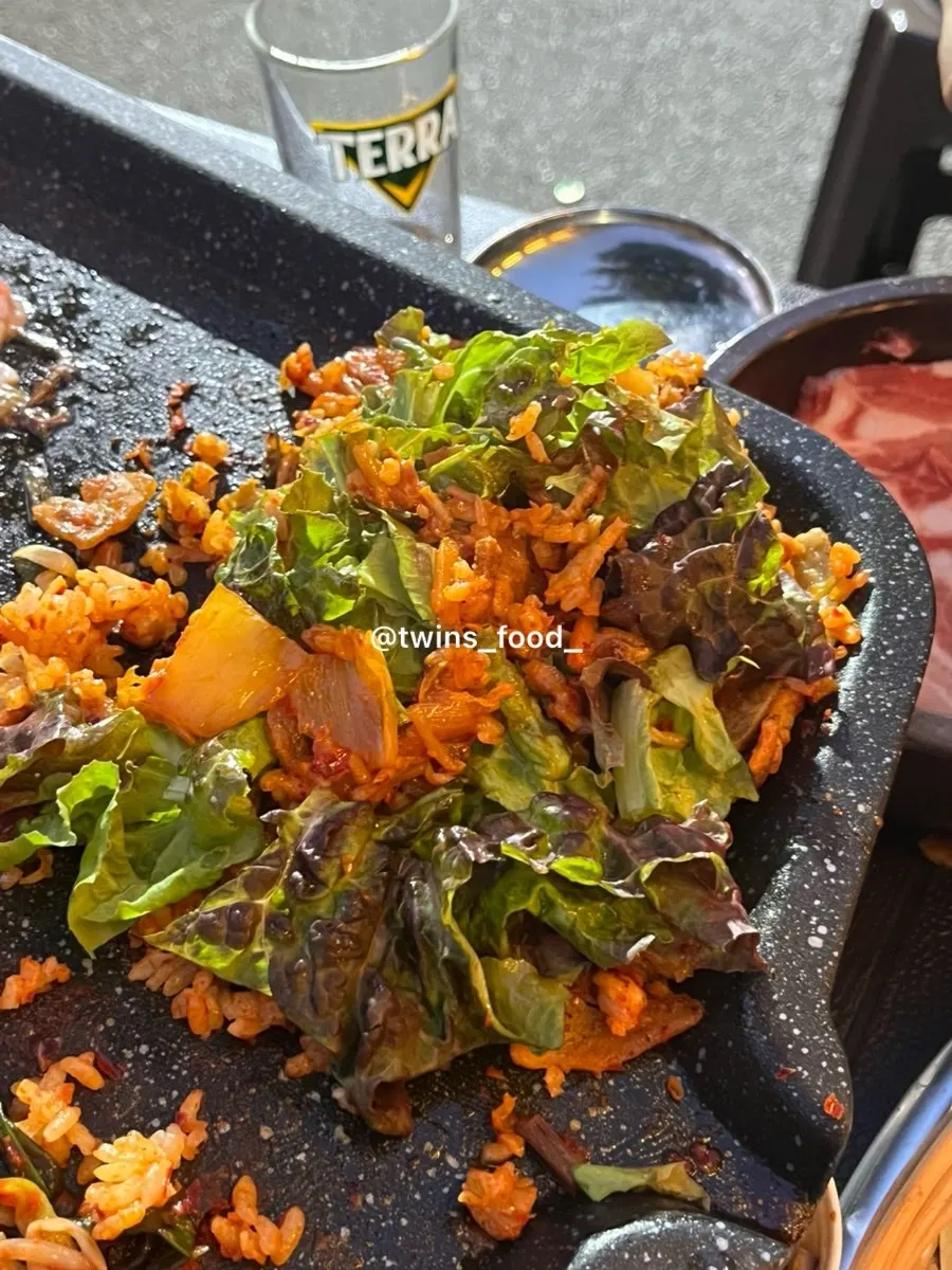 Rice fried in the leftover fat on the grill