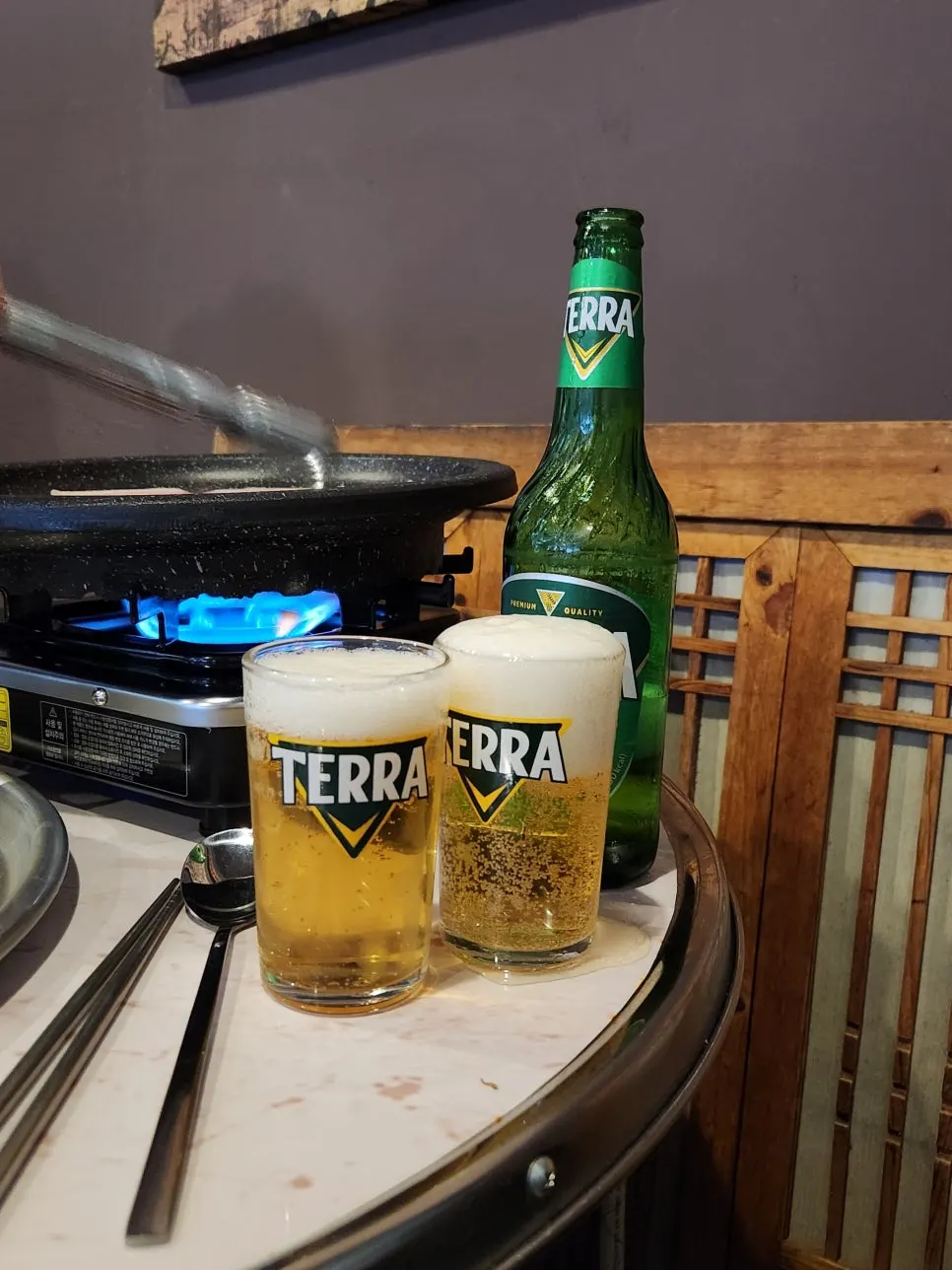 Terra beer placed on the outdoor tent table