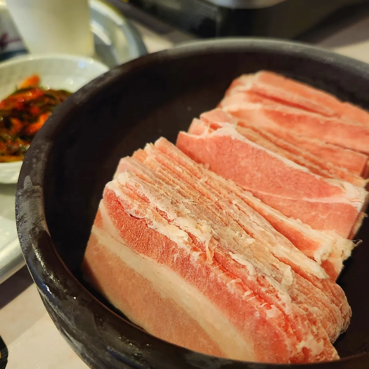 Frozen pork belly for two served in a jar at Chowon