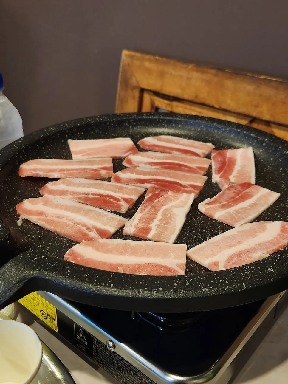 Pork belly grilling to a golden brown