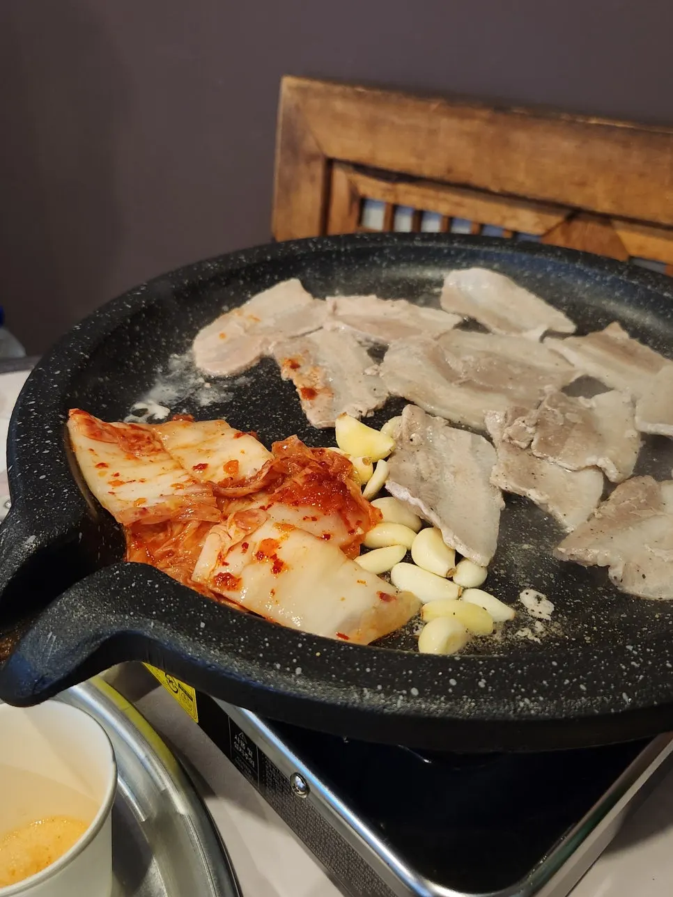 Grill with kimchi and garlic added on top